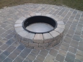 Brick paver patio Deland Sandford Palm Coast fire pit natural stone travertine installation design